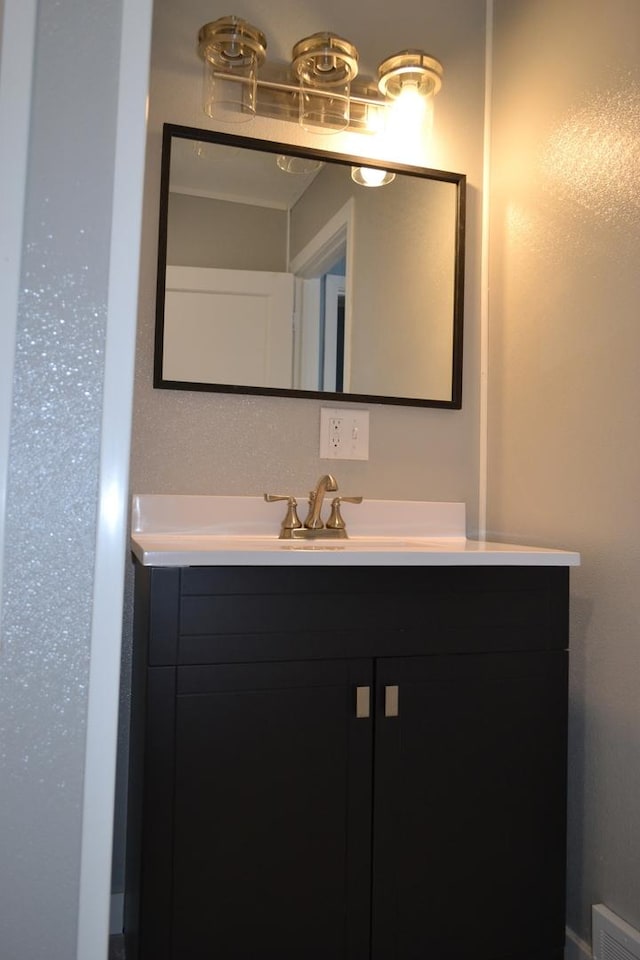 bathroom with visible vents and vanity