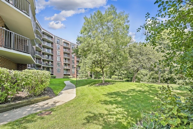 view of home's community with a lawn