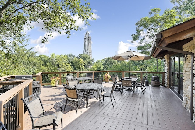 wooden deck with outdoor dining area