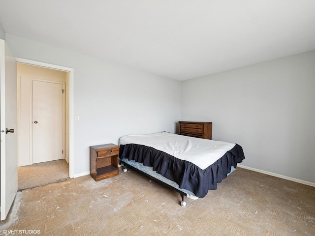 bedroom featuring baseboards