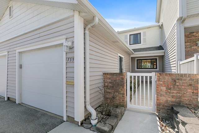 entrance to property with a gate and fence