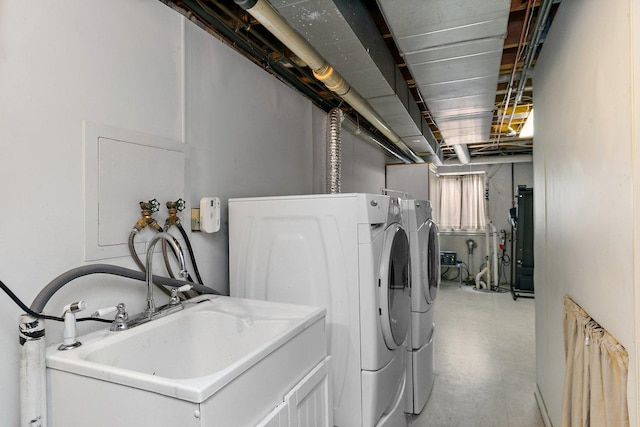 laundry area featuring washing machine and clothes dryer and laundry area