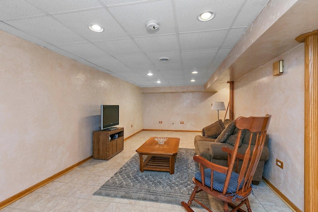 living area with recessed lighting, a paneled ceiling, visible vents, and baseboards