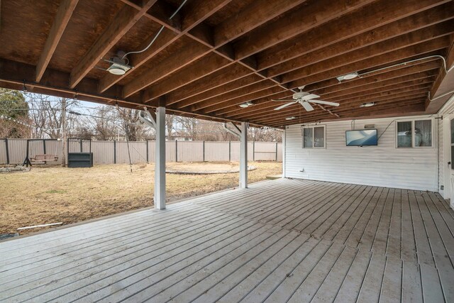 wooden deck featuring ceiling fan and fence