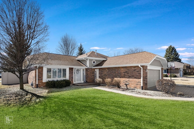 view of front facade featuring brick siding, roof with shingles, an attached garage, and a front yard