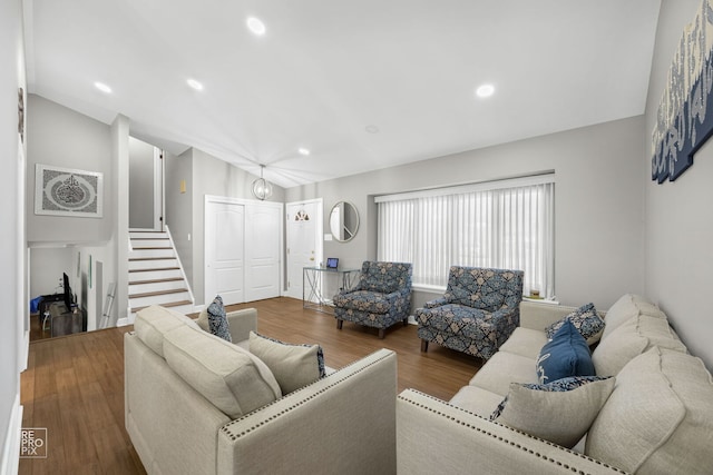 living room featuring stairs, wood finished floors, and recessed lighting