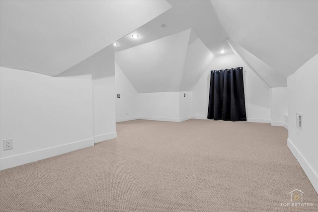 bonus room featuring recessed lighting, light carpet, visible vents, baseboards, and vaulted ceiling