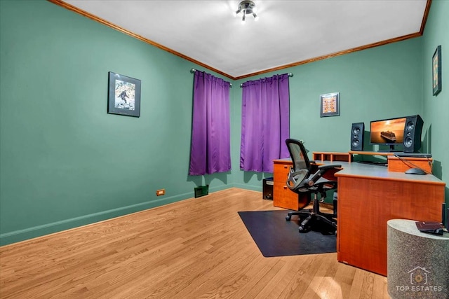 office featuring ornamental molding, wood finished floors, and baseboards