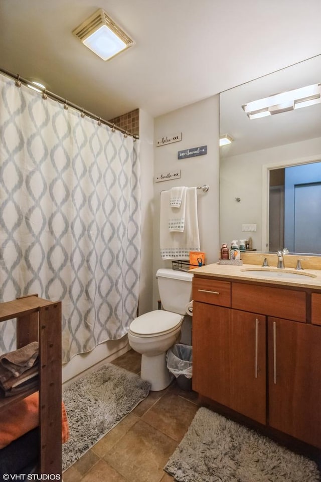 bathroom with toilet, tile patterned floors, visible vents, and vanity