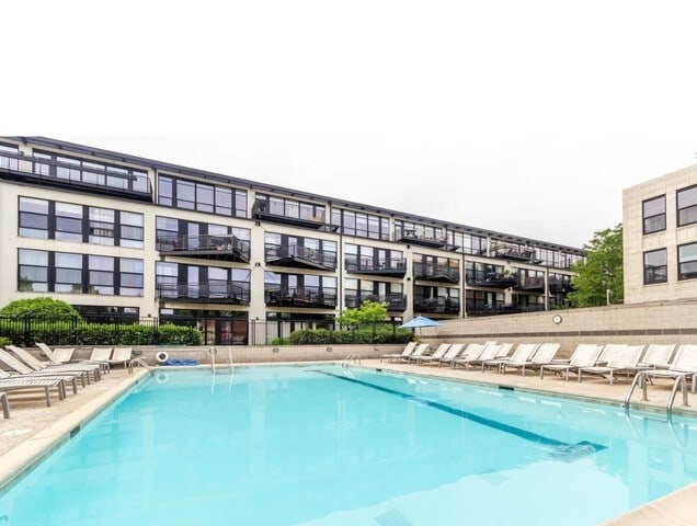 pool featuring a patio area and fence