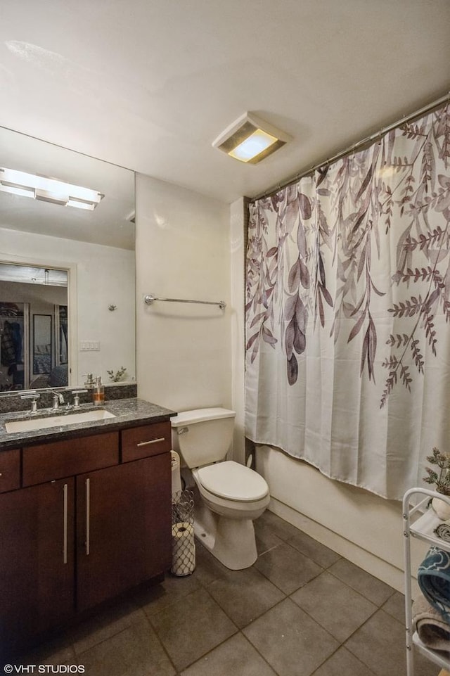 bathroom featuring visible vents, toilet, tile patterned flooring, shower / bath combination with curtain, and vanity