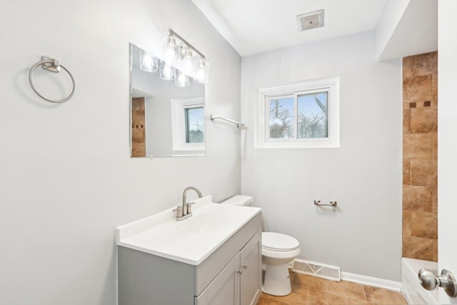 bathroom featuring baseboards, visible vents, vanity, and toilet