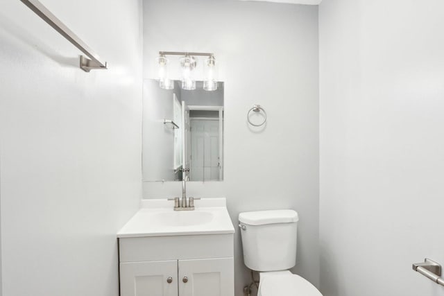 bathroom with toilet and vanity