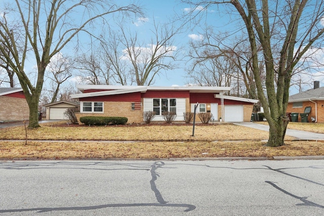 view of front facade featuring a garage and brick siding