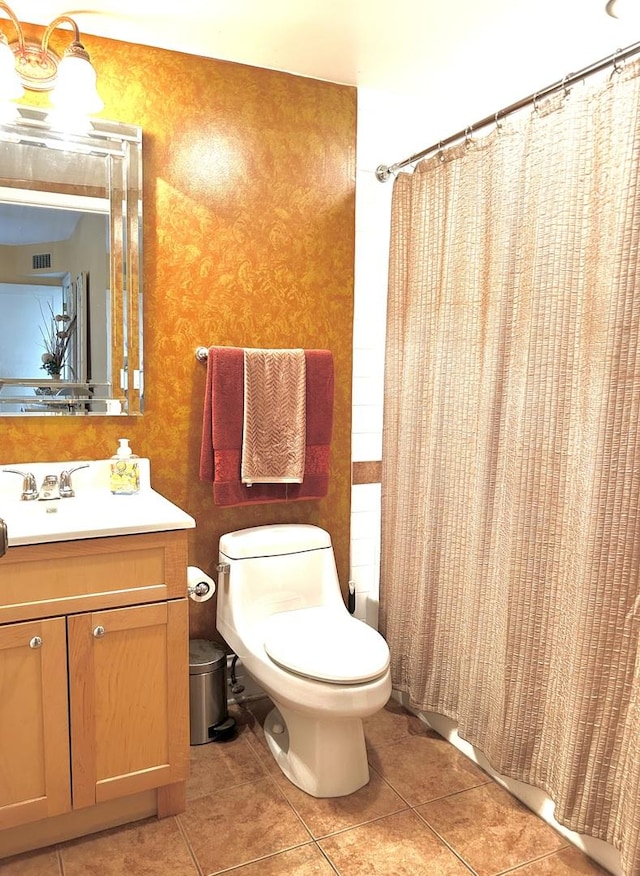 full bathroom featuring toilet, a shower with shower curtain, visible vents, vanity, and tile patterned floors