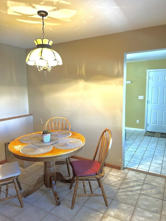 dining room featuring baseboards