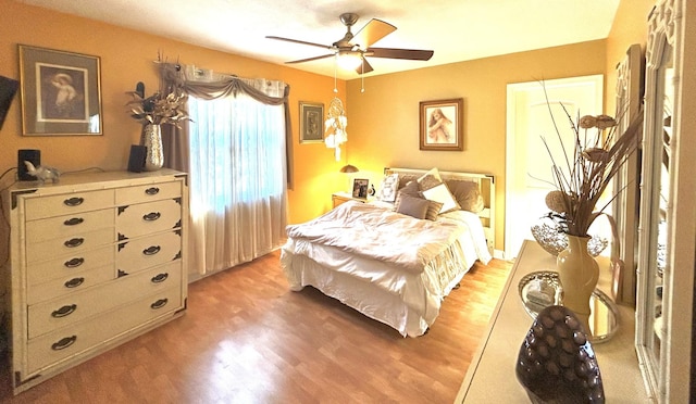 bedroom with ceiling fan and light wood-style floors