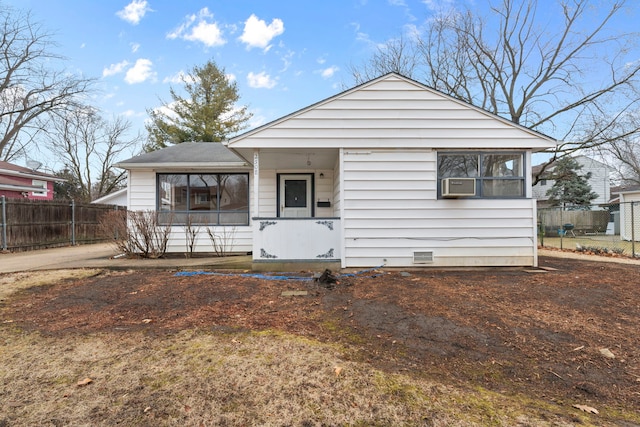 bungalow with a sunroom, cooling unit, crawl space, and fence