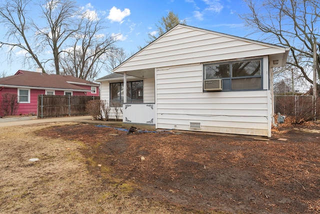 bungalow-style home with crawl space and fence