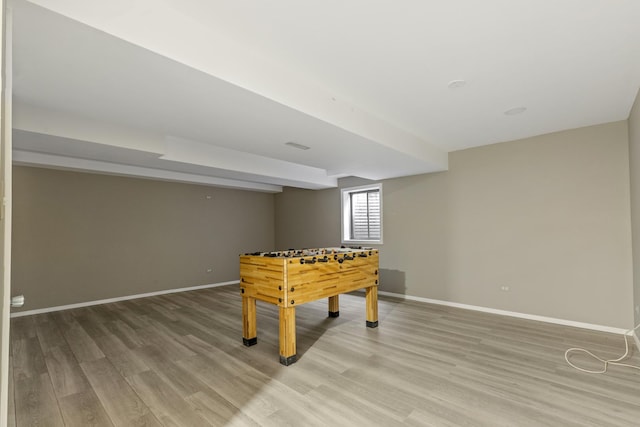 recreation room featuring light wood-type flooring and baseboards