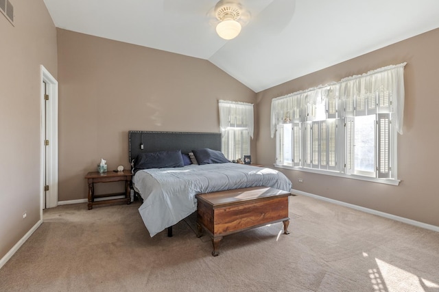 bedroom with vaulted ceiling, carpet, and baseboards