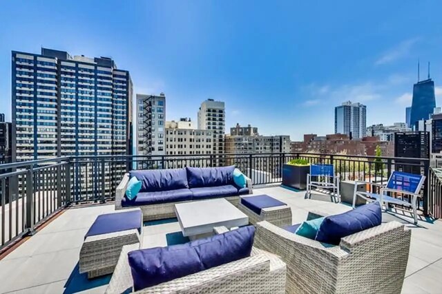 view of patio / terrace with a view of city and outdoor lounge area