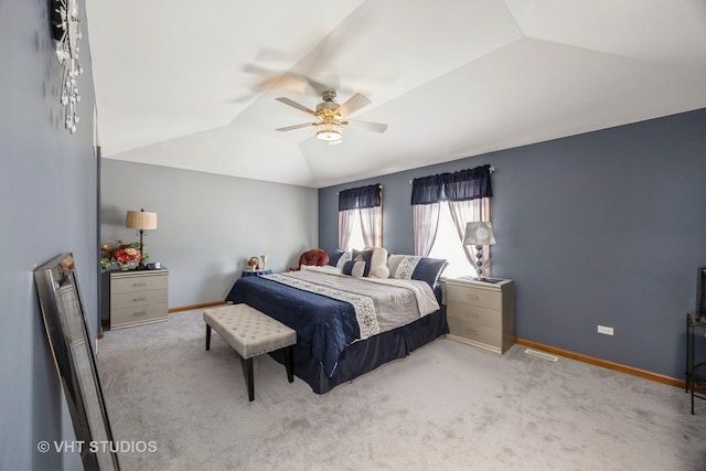 bedroom featuring a ceiling fan, lofted ceiling, carpet, and baseboards