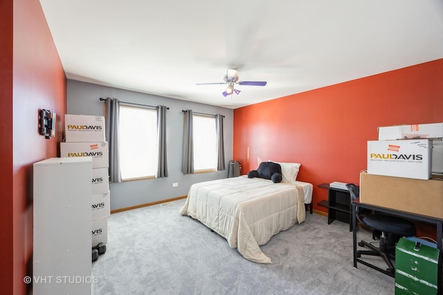 bedroom featuring a ceiling fan, carpet, and baseboards