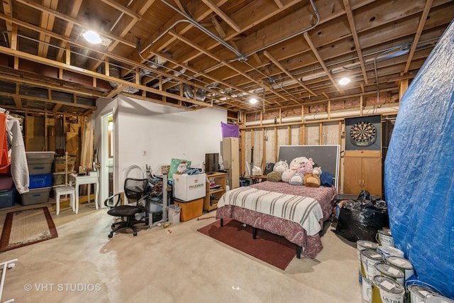 bedroom featuring concrete floors