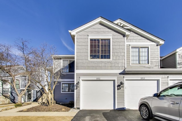 view of front facade featuring driveway and an attached garage