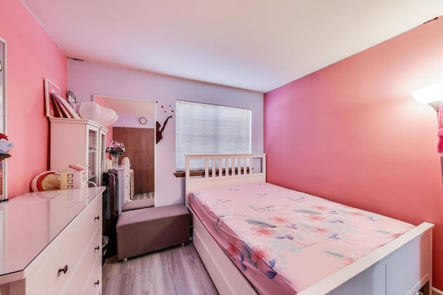 bedroom featuring light wood finished floors