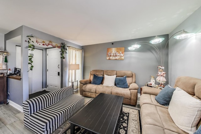 living room with wood finished floors and baseboards