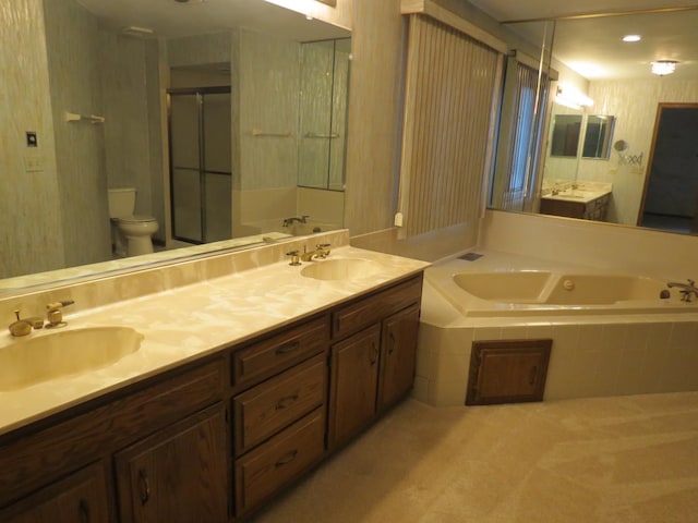 full bathroom featuring double vanity, a sink, and a bath