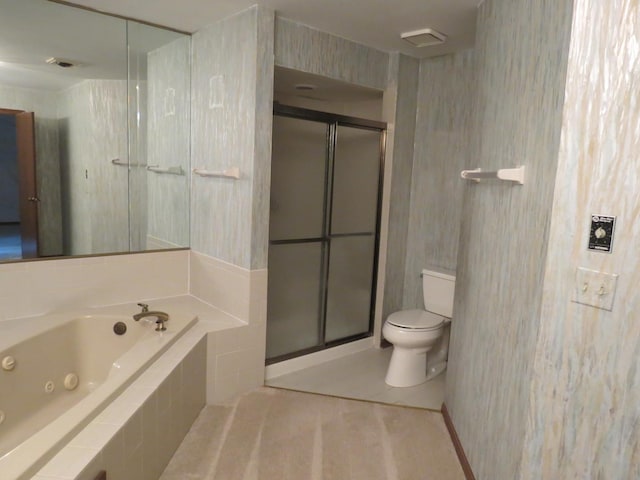 bathroom with toilet, a stall shower, and a jetted tub