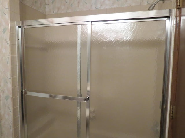 bathroom featuring a stall shower