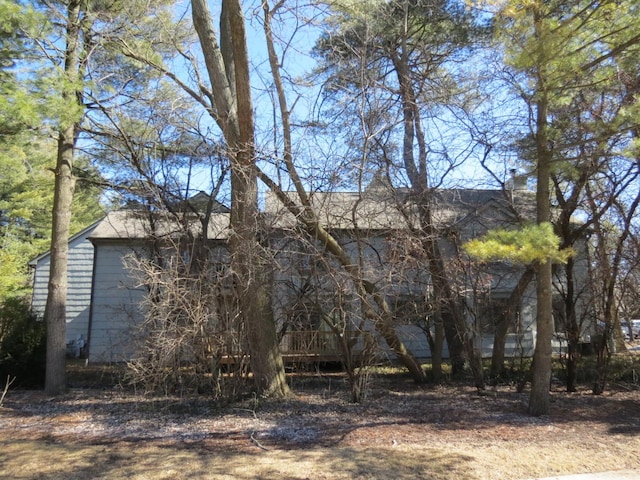 view of property exterior with a chimney