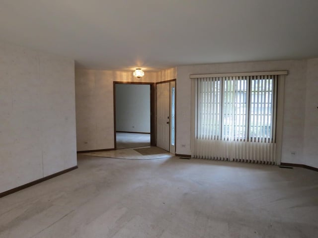 unfurnished room featuring carpet flooring