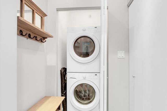 laundry area with stacked washer / dryer