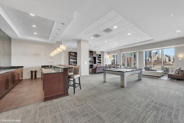 playroom featuring billiards, baseboards, a tray ceiling, recessed lighting, and light colored carpet