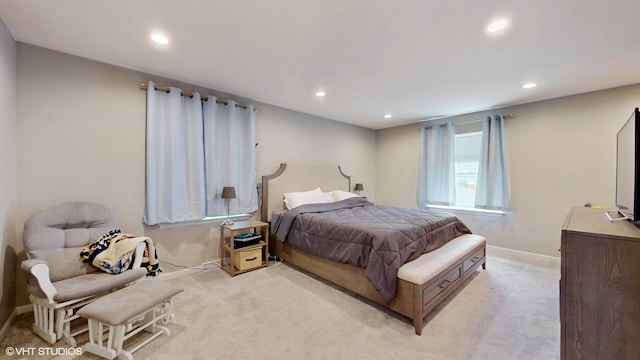 bedroom with recessed lighting, baseboards, and light colored carpet