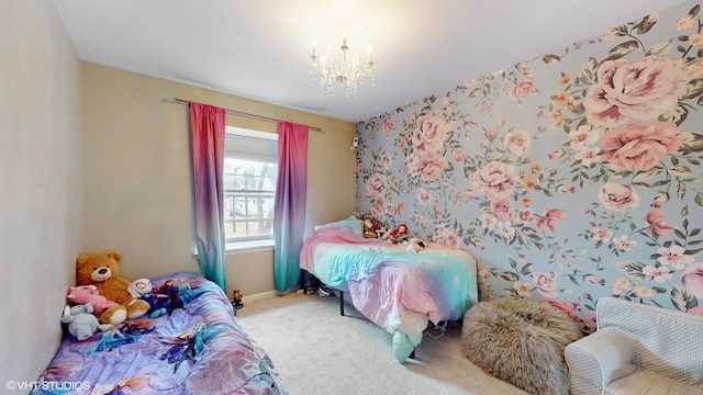 carpeted bedroom with a chandelier and baseboards