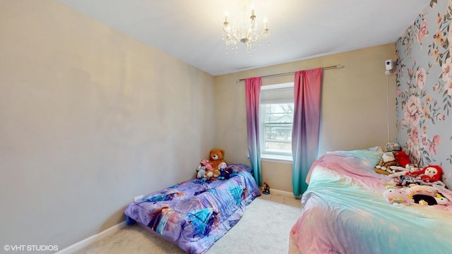 carpeted bedroom with baseboards and a notable chandelier