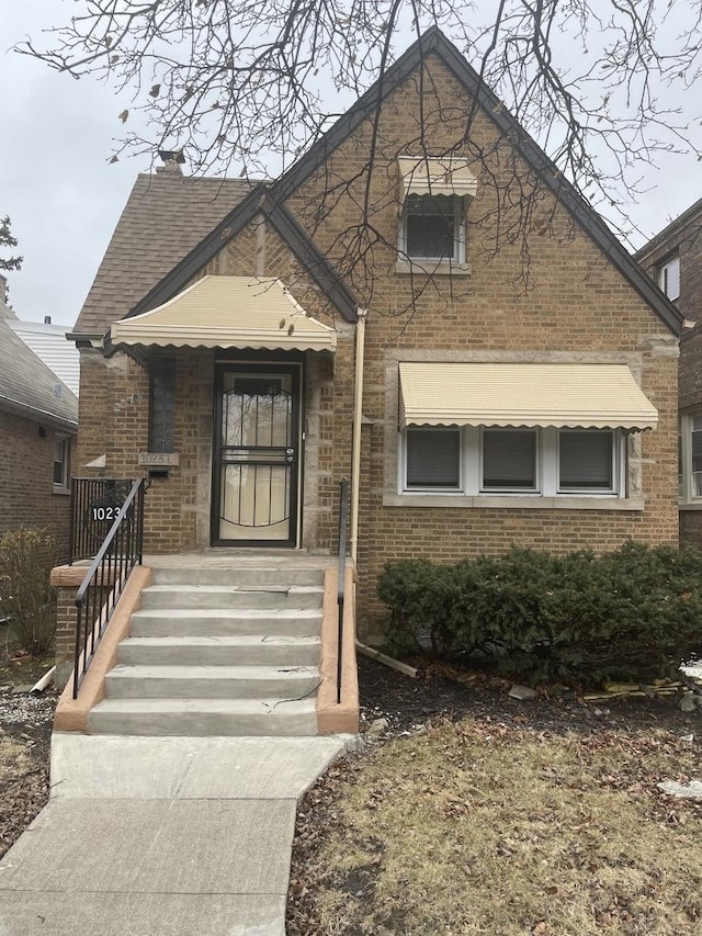 view of front of house with brick siding