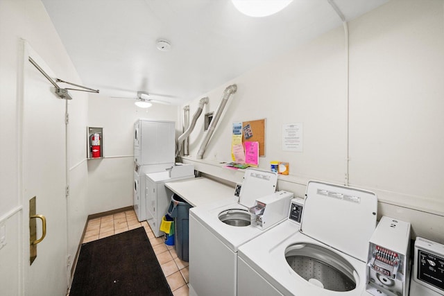 community laundry room with ceiling fan, stacked washer and dryer, light tile patterned floors, and independent washer and dryer