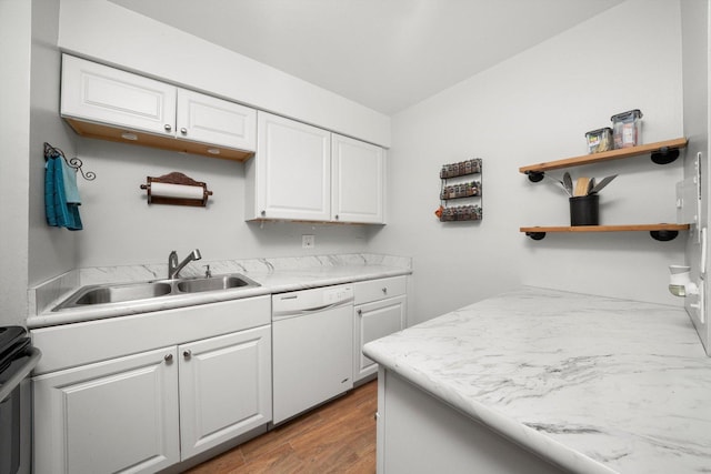 kitchen with white cabinets, white dishwasher, light wood-style floors, open shelves, and a sink