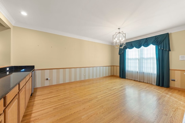 2811 Haven Ct, Naperville, IL 60564 - interior space featuring a wainscoted wall, crown molding, light wood-style floors, and a chandelier