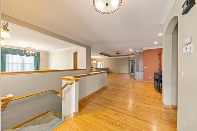 2811 Haven Ct, Naperville, IL 60564 - corridor featuring ornamental molding, baseboards, arched walkways, light wood finished floors, and a notable chandelier