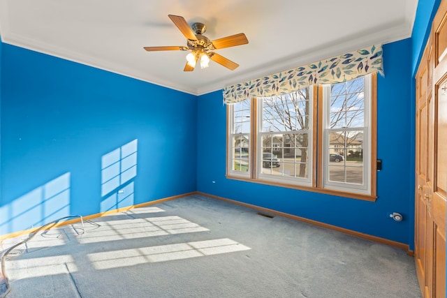 2811 Haven Ct, Naperville, IL 60564 - spare room with crown molding, carpet, baseboards, ceiling fan, and visible vents