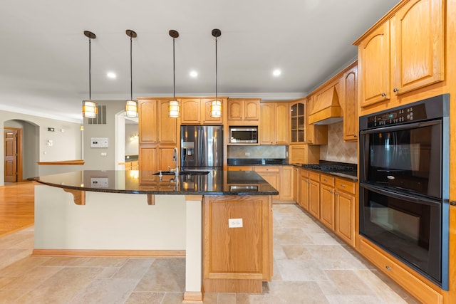 2811 Haven Ct, Naperville, IL 60564 - kitchen featuring a large island with sink, tasteful backsplash, a sink, arched walkways, and black appliances