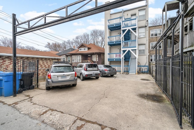 view of car parking featuring fence